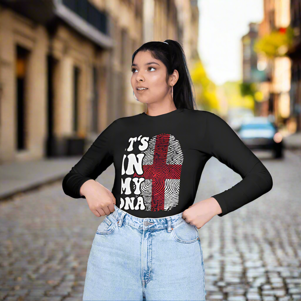 Woman wearing a black long-sleeve shirt with a design of St George's England Flag and text.
